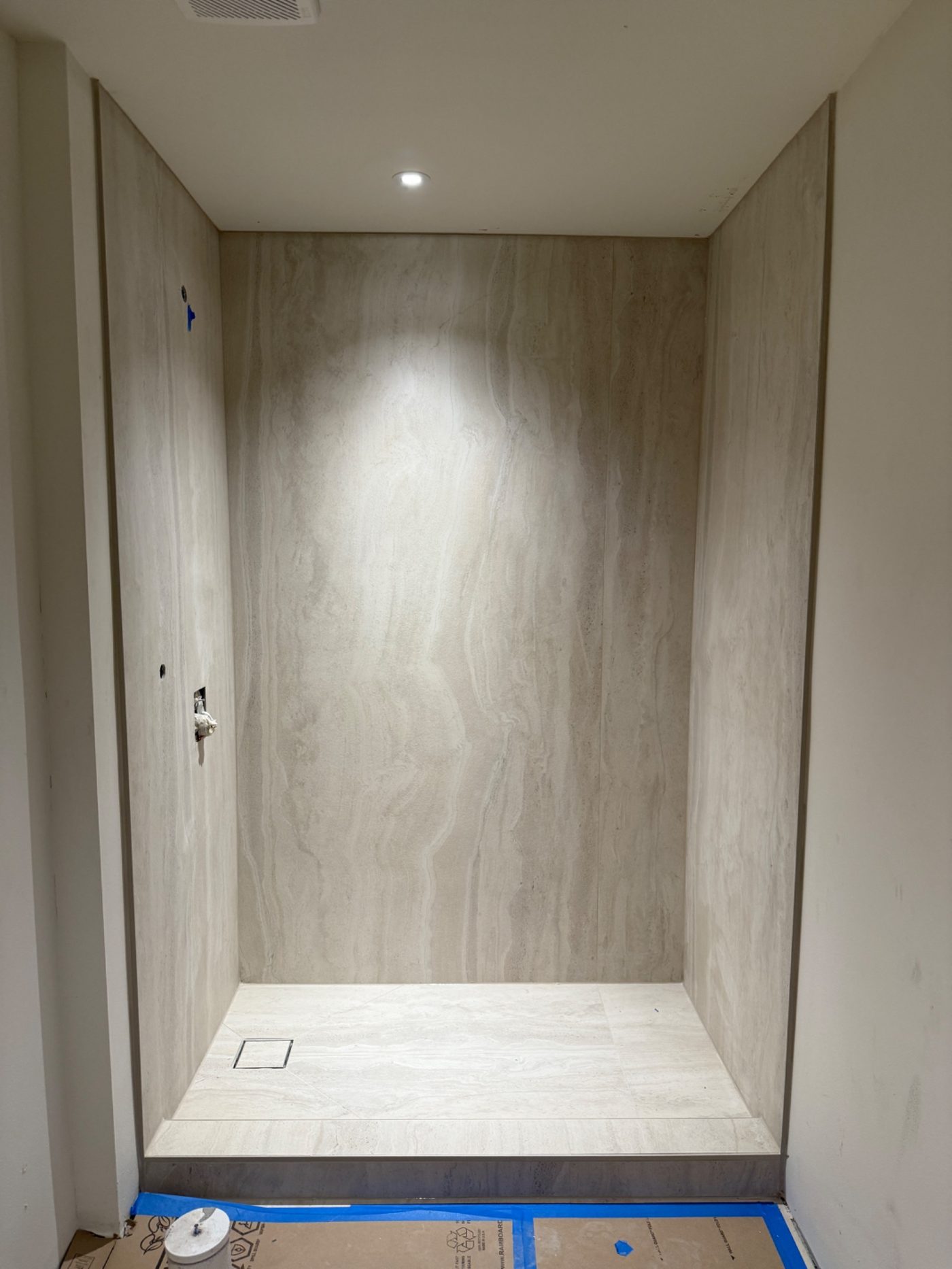 Slab Porcelain Shower Under Spotlight